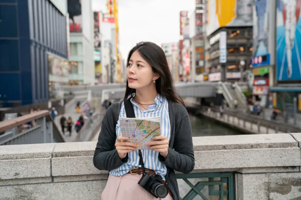 Tourist using map in Osaka